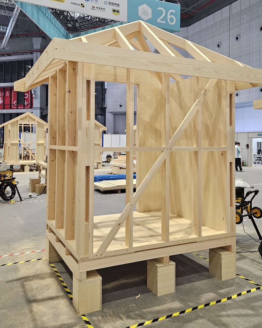 The completed timber-frame house, carpentry competition